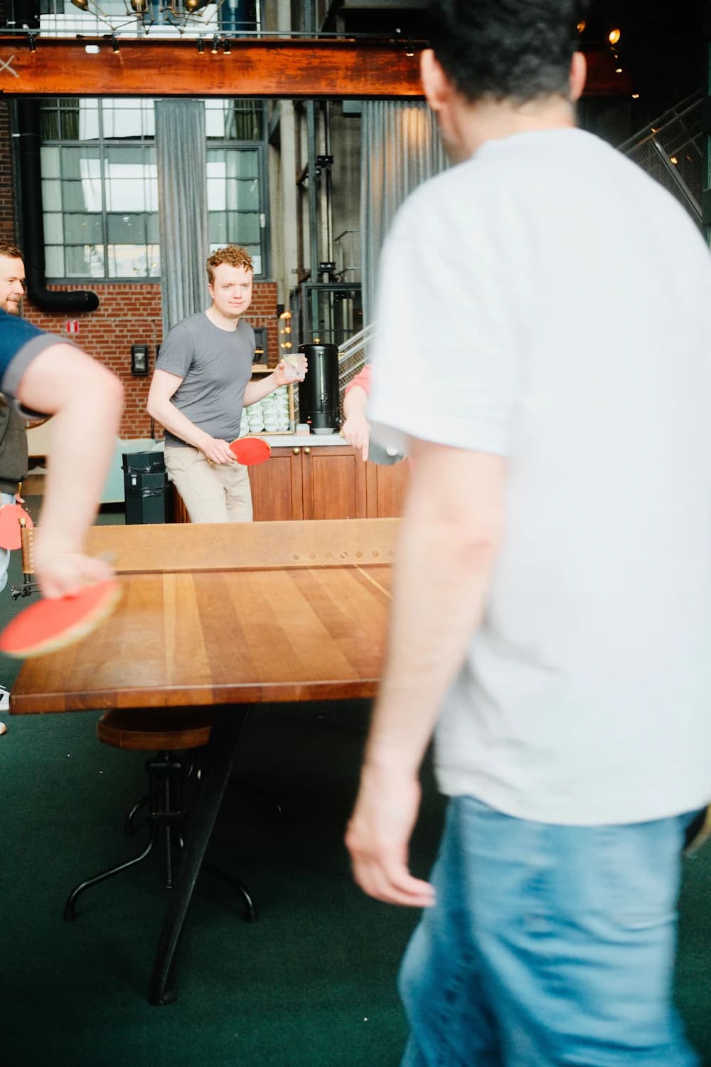 Colleagues playing table tennis